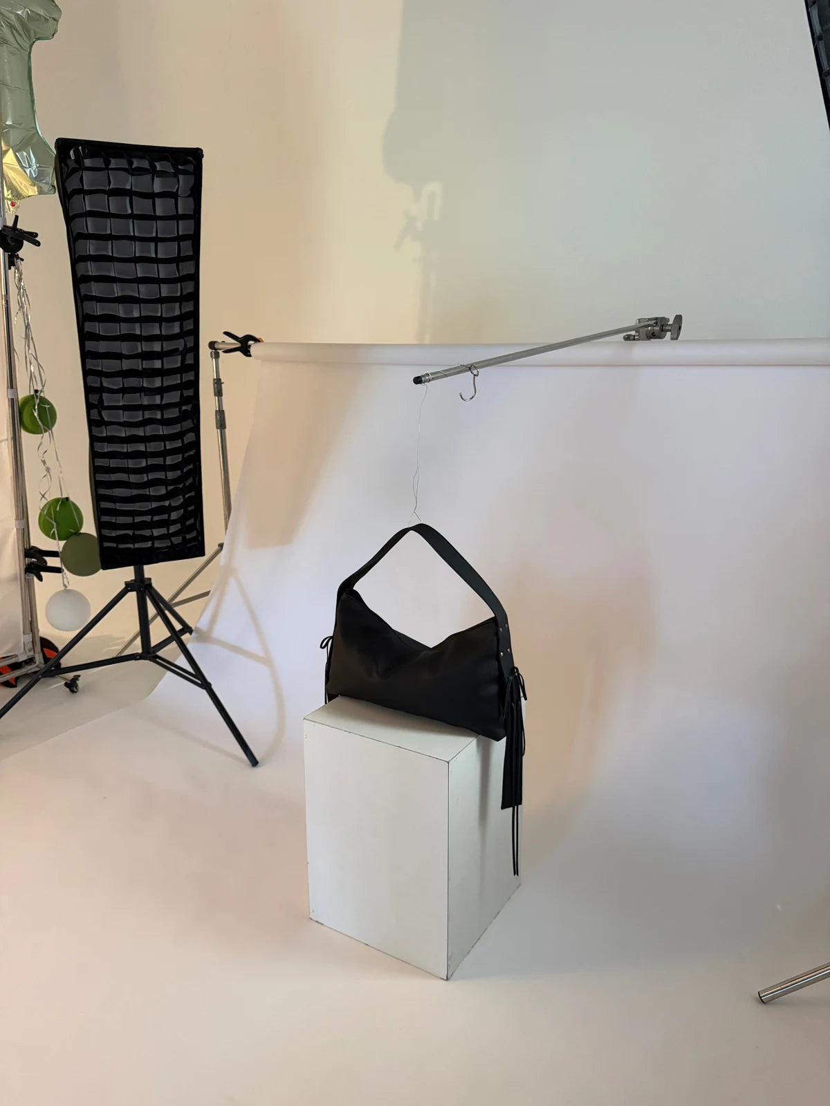 A black KÖVI handbag photographed in the studio